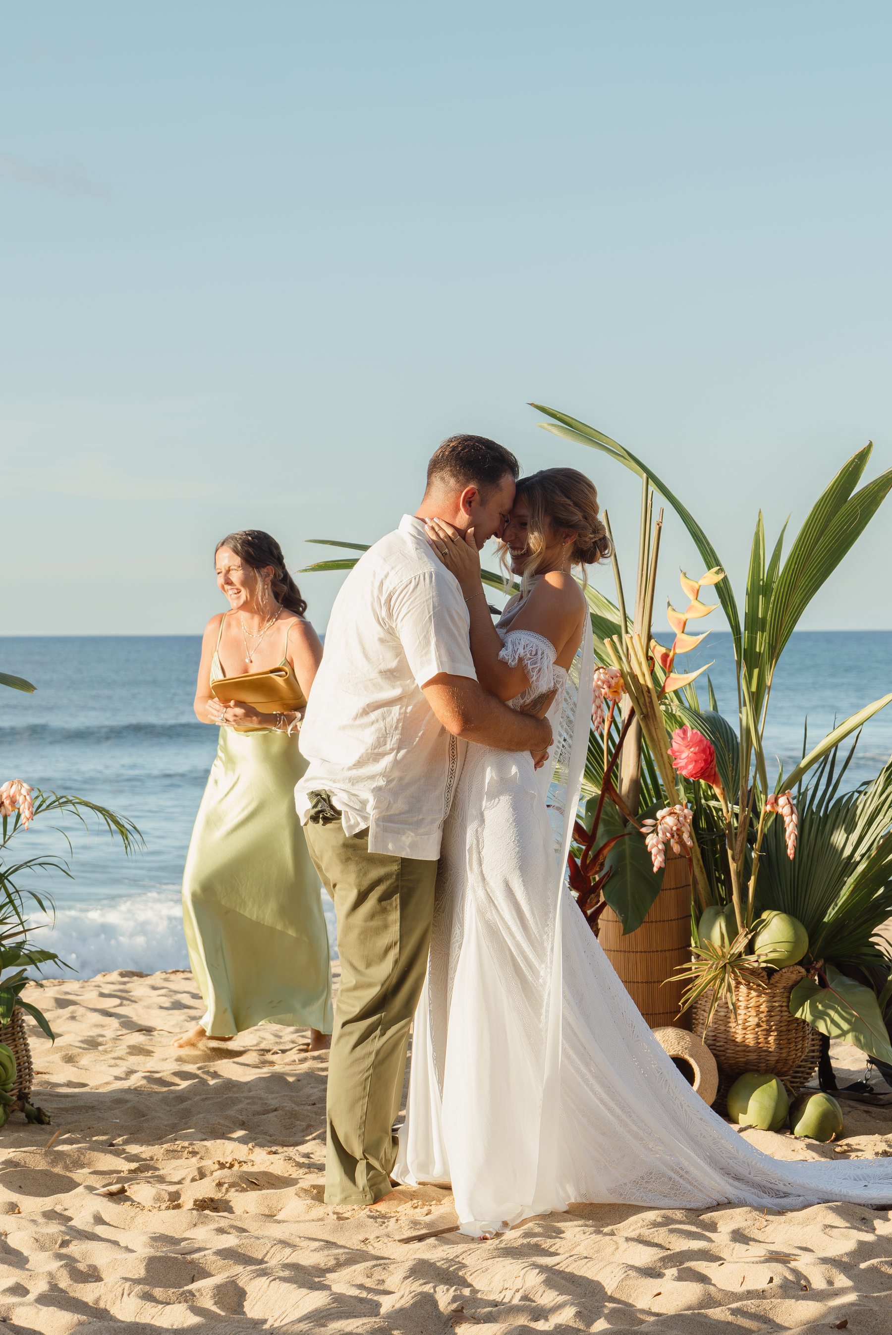 Amanda and Joe sharing a candid beachfront moment
