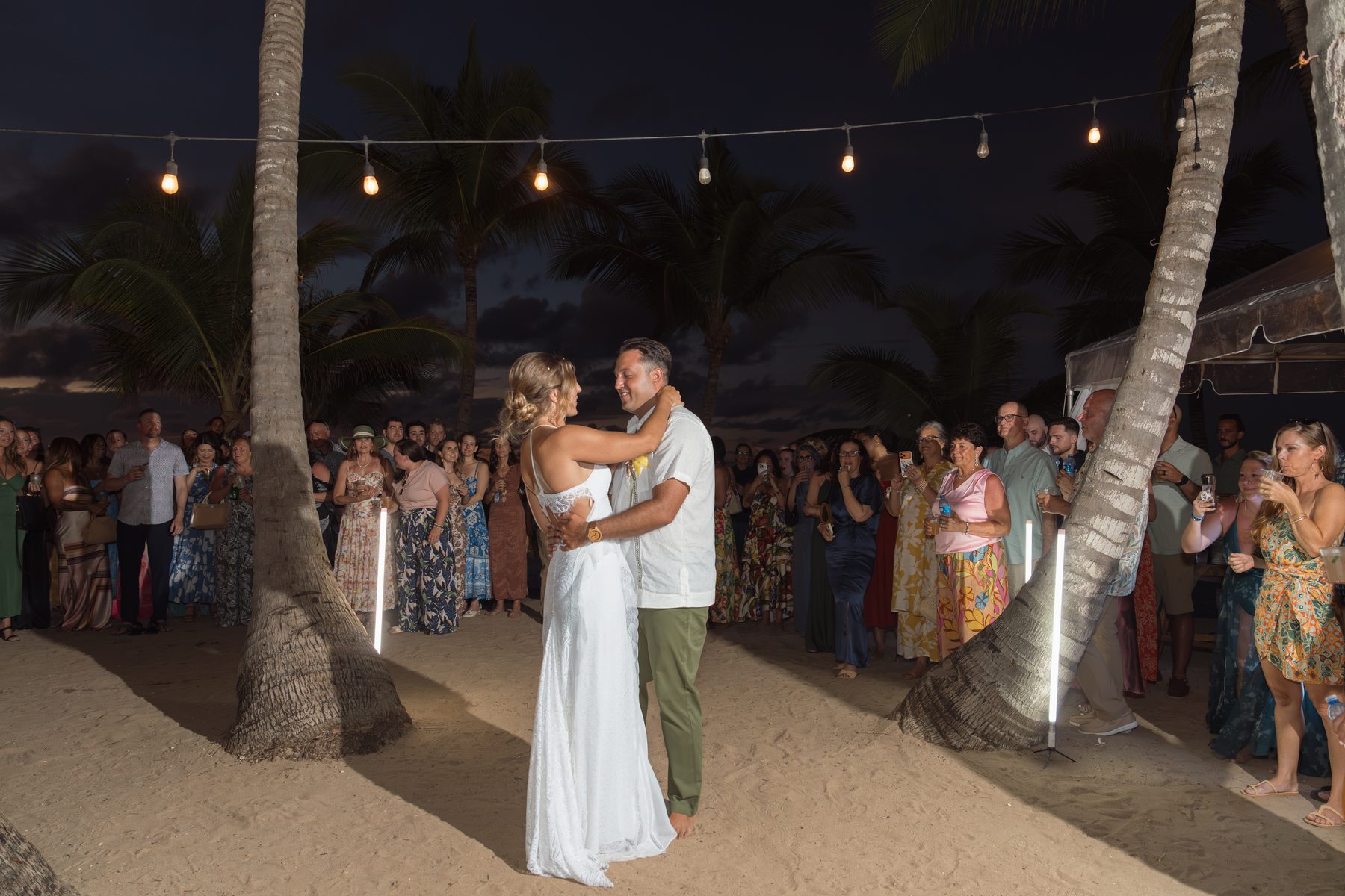 Amanda and Joe surrounded by friends and family during their Casa Isleña wedding reception